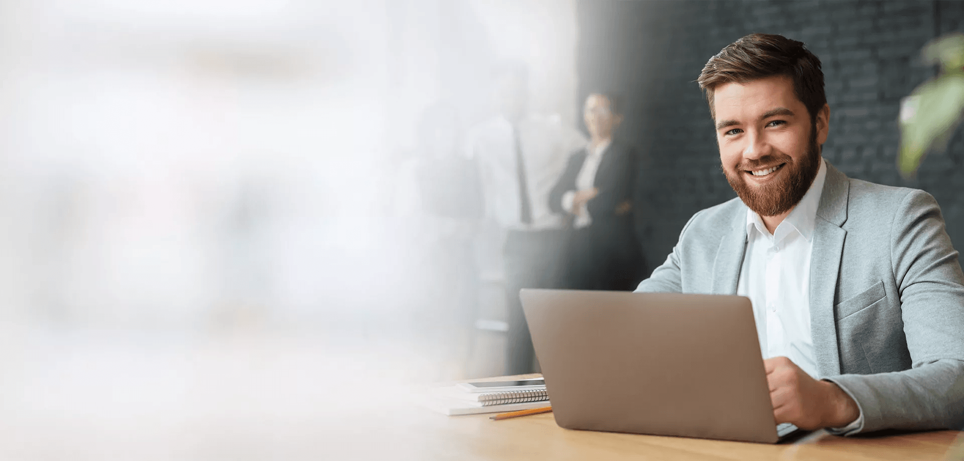 Professional businessman with laptop as background